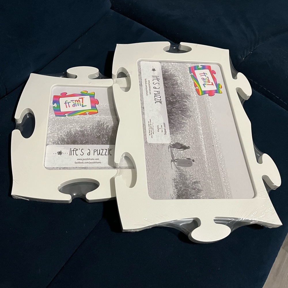 Tommy White Pair of Framz Puzzle Piece shaped Pic Frames, plastic, 7in x 12in